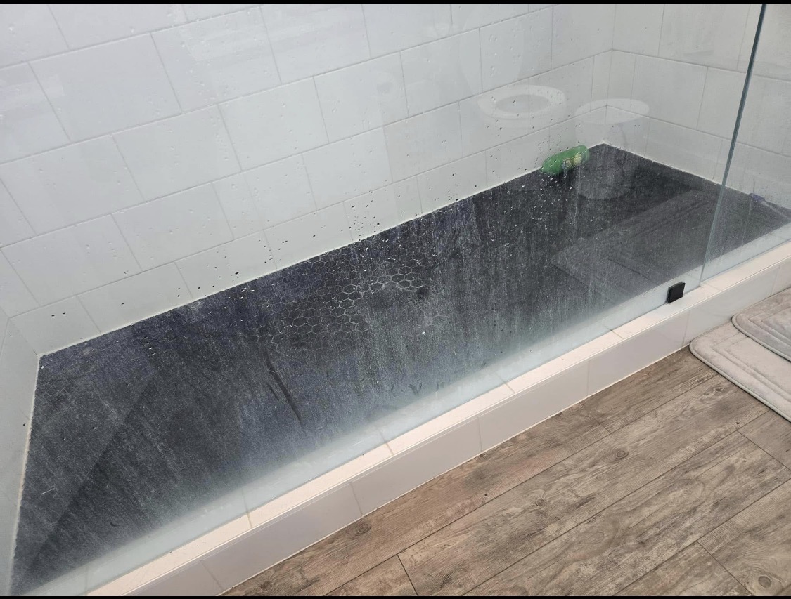 Shower floor before cleaning